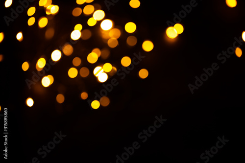 Golden sparkles raster festive background. Bokeh lights with bright shiny effect illustration. Overlapping glowing and twinkling spots decorative backdrop. Abstract glittering circles. © Mirror Flow