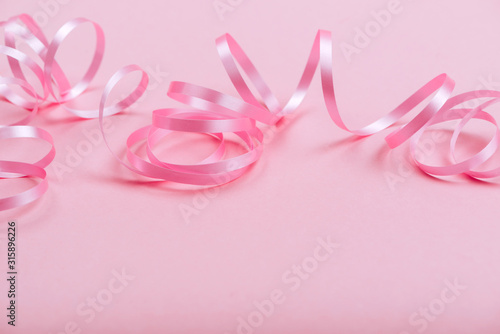 beautiful pink ribbon on bright background copy space