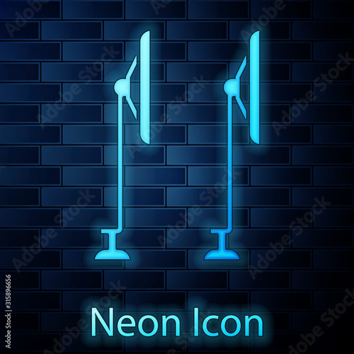 Glowing neon Windscreen wiper icon isolated on brick wall background. Vector Illustration