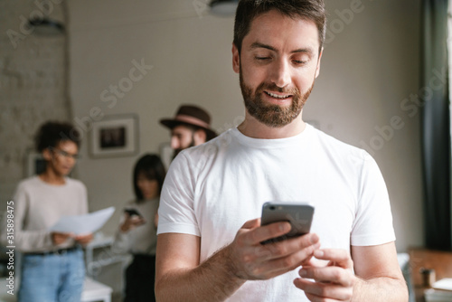 Image of multiethnic young business people working together at office