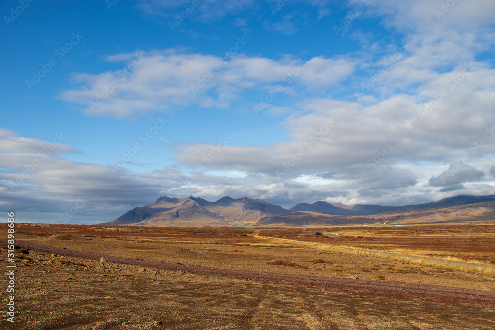 rough landscape in Iceland, blue sky, mountains
