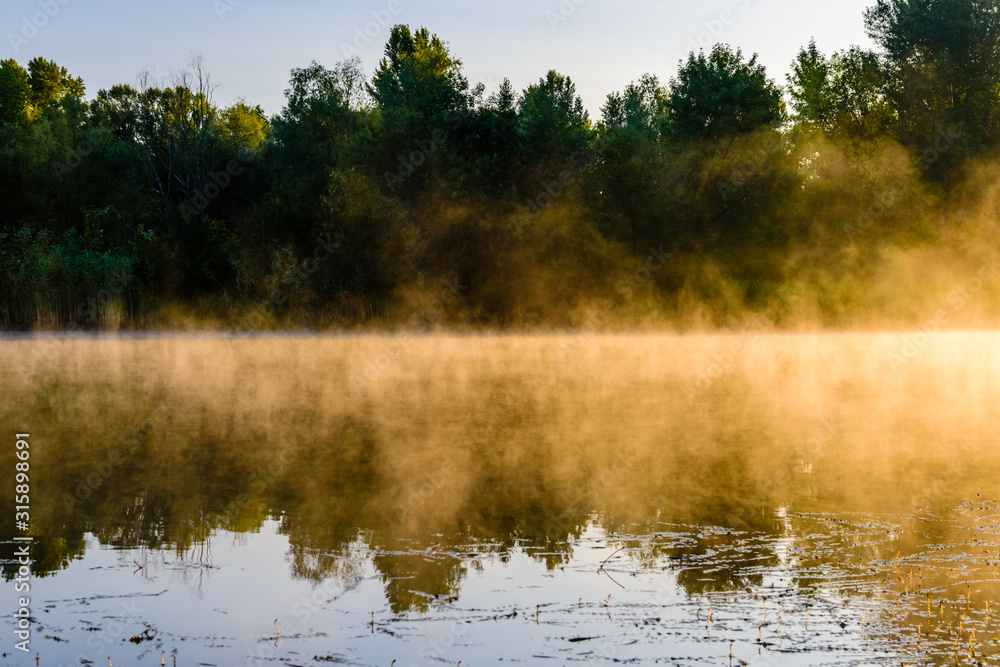 Fog above the water surface. Sunrise at river Fog above the water surface. Sunrise at river