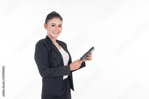 An attractive woman wearing business attire holding a tablet with various poses isolated on white background. Suitable for image cut out and manipulation works for technology,business or finance theme