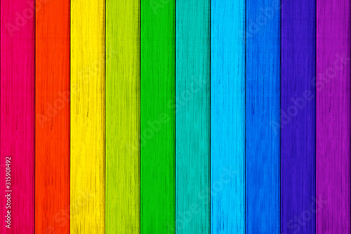 Rainbow colored wood texture background.