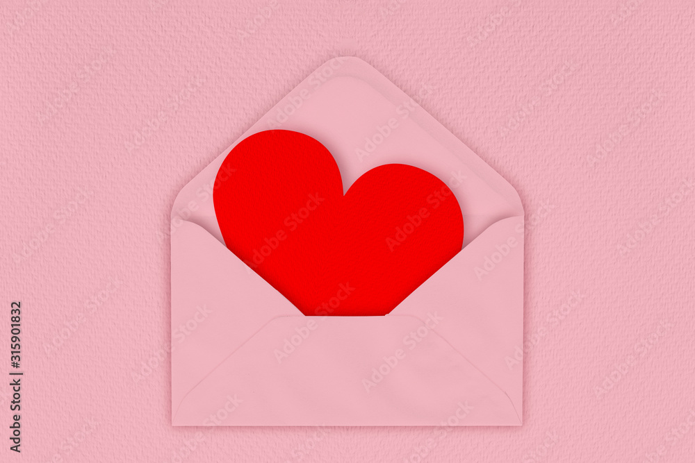 Red heart in envelope on pink background. love letter. Red heart in envelope on pink background. love letter.