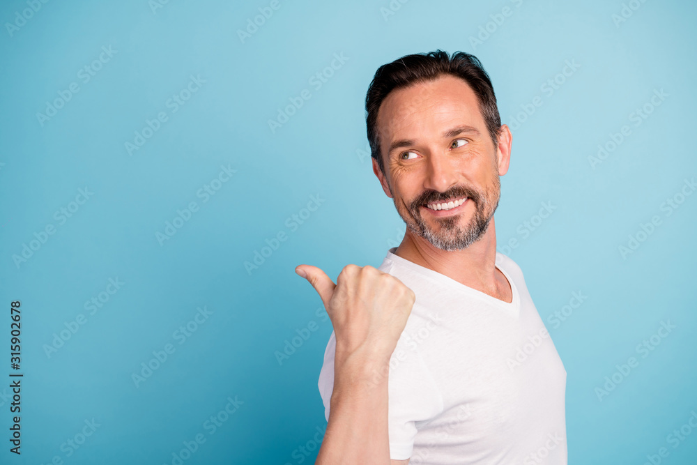 Close-up portrait of his he nice attractive cheerful cheery guy showing copy empty blank space ad advert solution isolated on bright vivid shine vibrant teal green blue turquoise color background Close-up portrait of his he nice attractive cheerful cheery guy showing copy empty blank space ad advert solution isolated on bright vivid shine vibrant teal green blue turquoise color background