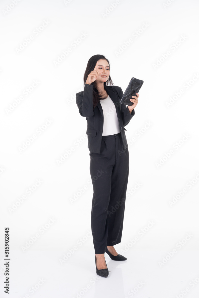 An attractive woman wearing business attire holding a tablet with various poses isolated on white background. Suitable for image cut out and manipulation works for technology,business or finance theme An attractive woman wearing business attire holding a tablet with various poses isolated on white background. Suitable for image cut out and manipulation works for technology,business or finance theme