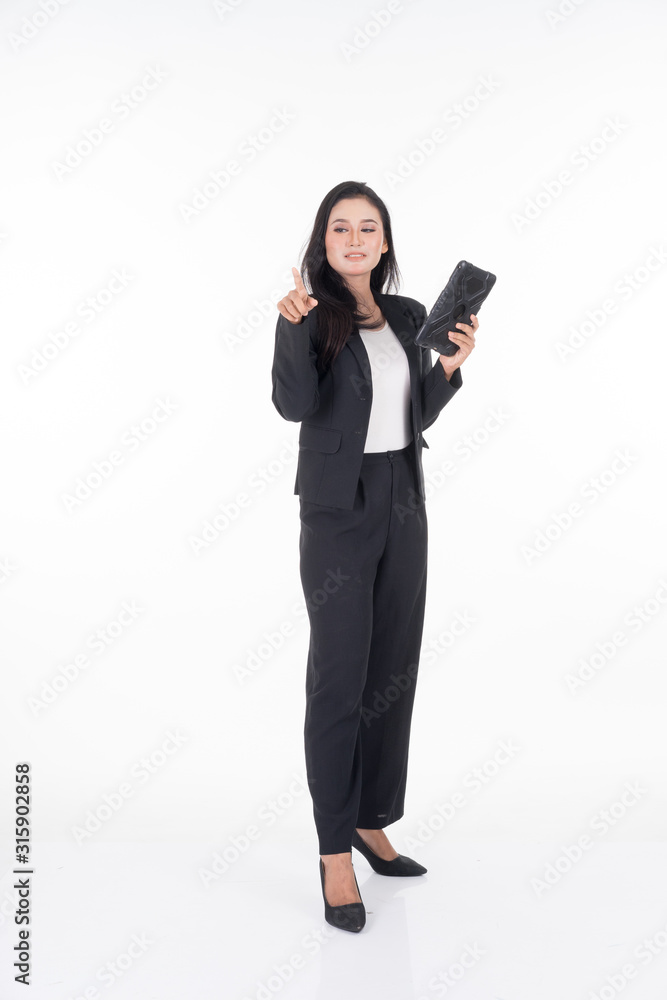 An attractive woman wearing business attire holding a tablet with various poses isolated on white background. Suitable for image cut out and manipulation works for technology,business or finance theme An attractive woman wearing business attire holding a tablet with various poses isolated on white background. Suitable for image cut out and manipulation works for technology,business or finance theme