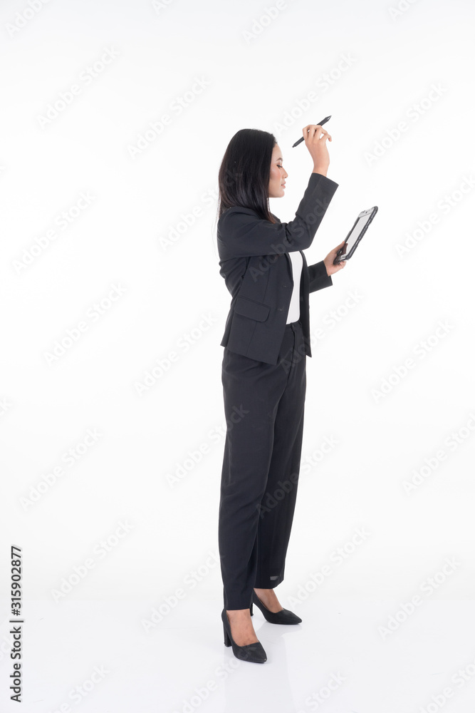 An attractive woman wearing business attire holding a tablet with various poses isolated on white background. Suitable for image cut out and manipulation works for technology,business or finance theme An attractive woman wearing business attire holding a tablet with various poses isolated on white background. Suitable for image cut out and manipulation works for technology,business or finance theme