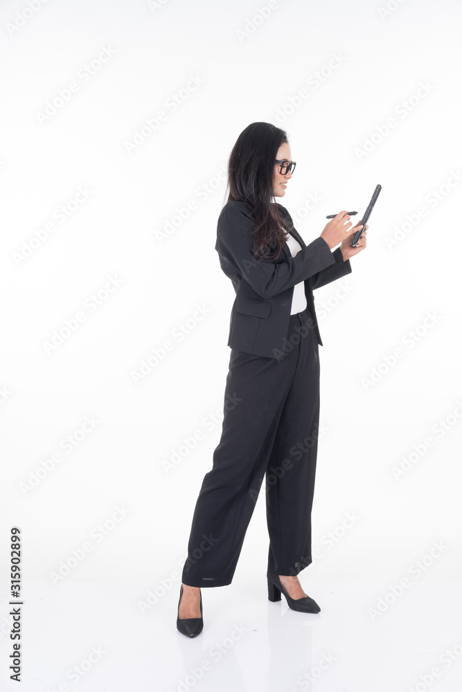 An attractive woman wearing business attire holding a tablet with various poses isolated on white background. Suitable for image cut out and manipulation works for technology,business or finance theme An attractive woman wearing business attire holding a tablet with various poses isolated on white background. Suitable for image cut out and manipulation works for technology,business or finance theme