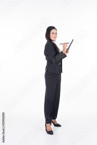 An attractive woman wearing business attire holding a tablet with various poses isolated on white background. Suitable for image cut out and manipulation works for technology,business or finance theme