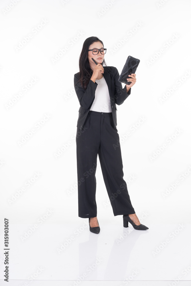An attractive woman wearing business attire holding a tablet with various poses isolated on white background. Suitable for image cut out and manipulation works for technology,business or finance theme An attractive woman wearing business attire holding a tablet with various poses isolated on white background. Suitable for image cut out and manipulation works for technology,business or finance theme