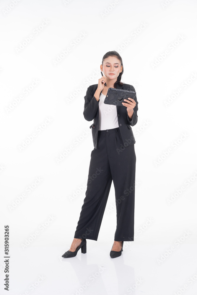 An attractive woman wearing business attire holding a tablet with various poses isolated on white background. Suitable for image cut out and manipulation works for technology,business or finance theme An attractive woman wearing business attire holding a tablet with various poses isolated on white background. Suitable for image cut out and manipulation works for technology,business or finance theme