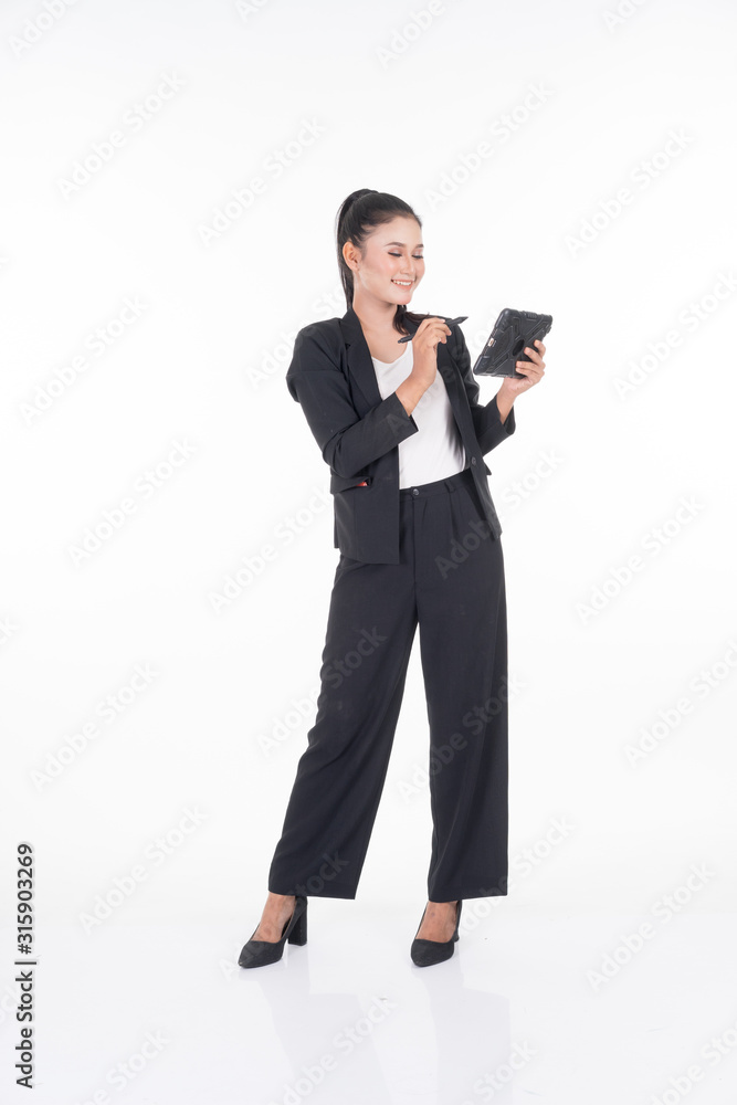 An attractive woman wearing business attire holding a tablet with various poses isolated on white background. Suitable for image cut out and manipulation works for technology,business or finance theme An attractive woman wearing business attire holding a tablet with various poses isolated on white background. Suitable for image cut out and manipulation works for technology,business or finance theme