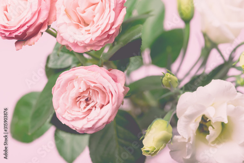 Fototapeta Naklejka Na Ścianę i Meble -  Beautiful Flowers in a Vase Spring Background White and Pink Flowers Horizontal Pink Roses and Eustoma Holiday Card