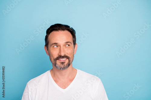 Close-up portrait of his he nice attractive curious genius cheerful dreamy guy freelancer thinking creating new idea isolated over bright vivid shine vibrant teal green blue turquoise color background