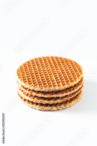 Food Concept Stroopwafel, crispy caramel syrup Dutch waffles isolated on white background