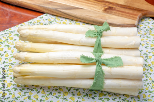 Bunch of fresh uncooked white asparagus, new harvest