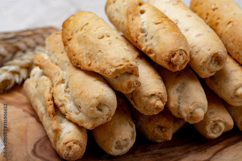 Small italian bread rolls crostini made from wheat dough with sesame Small italian bread rolls crostini made from wheat dough with sesame