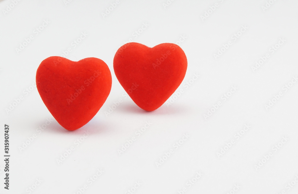 two red hearts on a white background