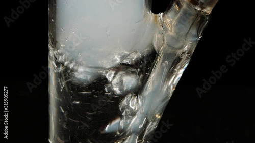 Glass Bong on black background.Smoking closeup.Marijuana,tobacco and Shisha.
