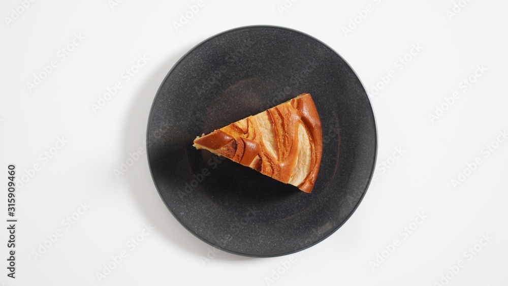 Apple pie, apple casserole on a black plate Apple pie, apple casserole on a black plate