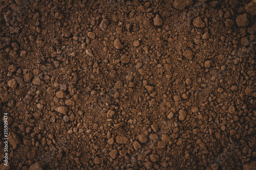 Top view of dark soil texture background