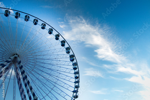  beautiful blue and white ferris wheel among the clouds