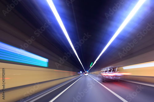 Car driving through tunnel