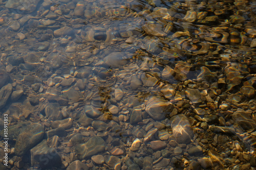 pebble stone under water closeup