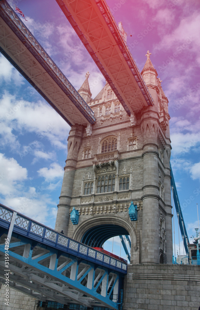 London's famous landmark Tower Bridge shot from the waterof Thames river. Light leaks edit. United Kingdom. 
