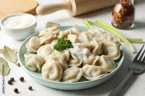 Composition with tasty dumplings on white background, close up