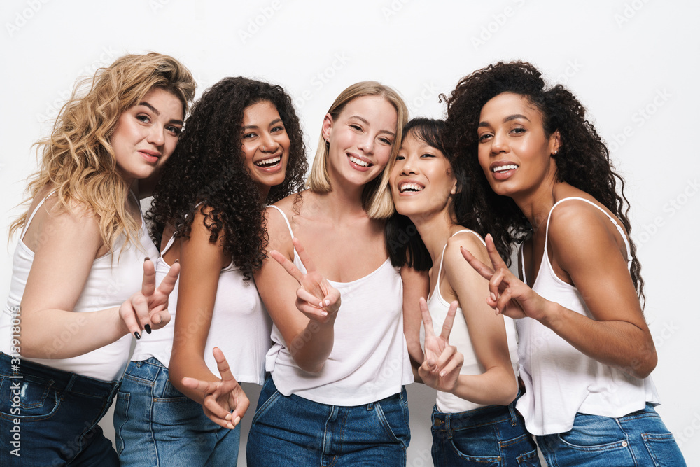 Image of pretty multinational women smiling and gesturing peace sign Image of pretty multinational women smiling and gesturing peace sign