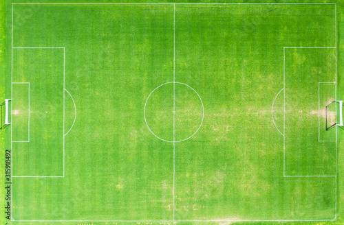 top view of green grass football stadium or field.