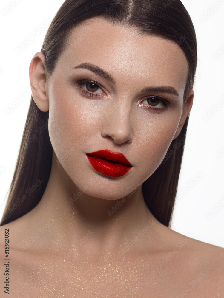 Close-up portrait of sexy european young woman model with classic glamour make-up and red lipstick. Dark long hairstyle, christmas makeup, dark eyeshadows, bloody red lips with gloss Close-up portrait of sexy european young woman model with classic glamour make-up and red lipstick. Dark long hairstyle, christmas makeup, dark eyeshadows, bloody red lips with gloss