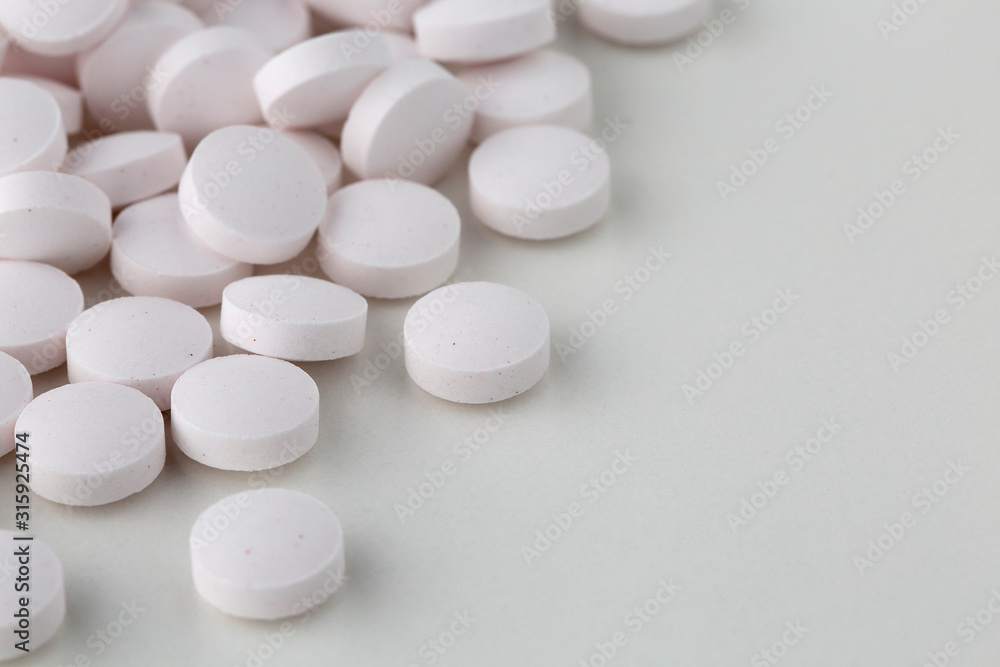 Pills tablets vitamins capsules drugs white close up macro shot Pills tablets vitamins capsules drugs white close up macro shot