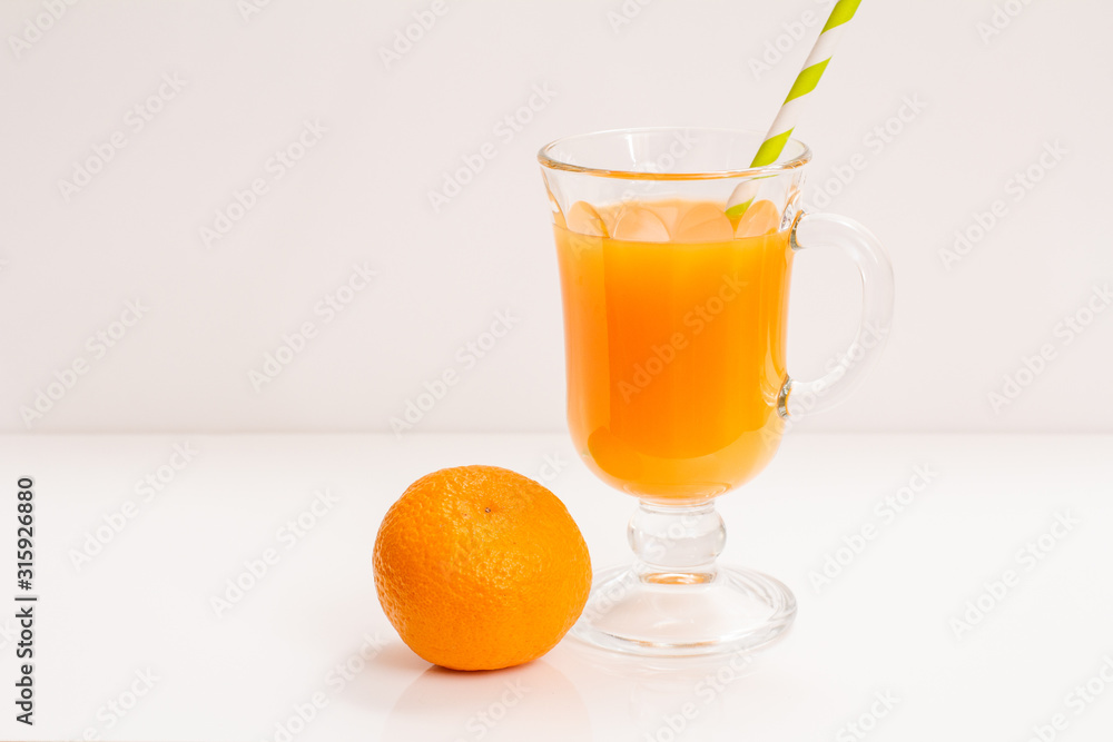 Fresh tropical fruits and glass of juice on white background. Fresh tropical fruits and glass of juice on white background.