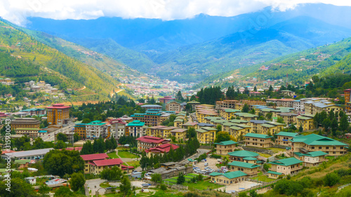 A large view of the capital of the Kingdom of Bhutan, called 'Thimphu' from a hill by day