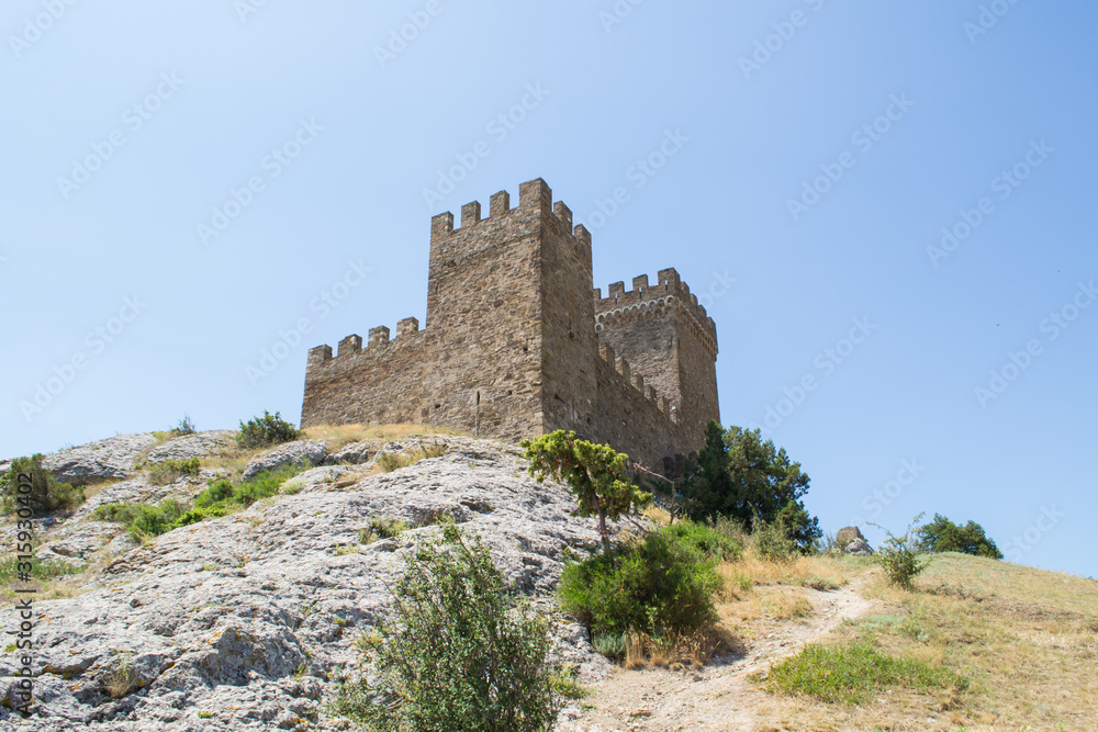 Ancient stone fortress on a rock in the city of 