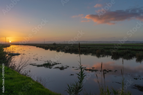 sunset by the river