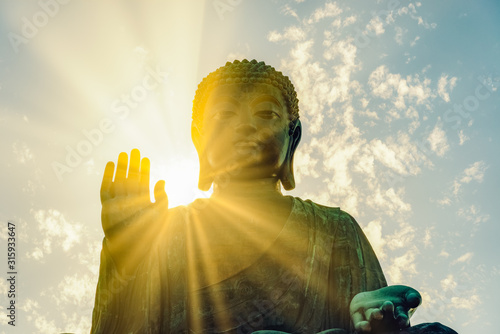 Giant Buddha statue or enormous Tian Tan Buddha at Po Lin Monastery in Hong Kong