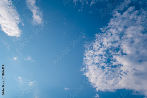 Blue Sky and Clouds. Daylight  mood. View  White clouds in the beautiful blue sky  Clouds in the blue sky. Oxygen  environment.