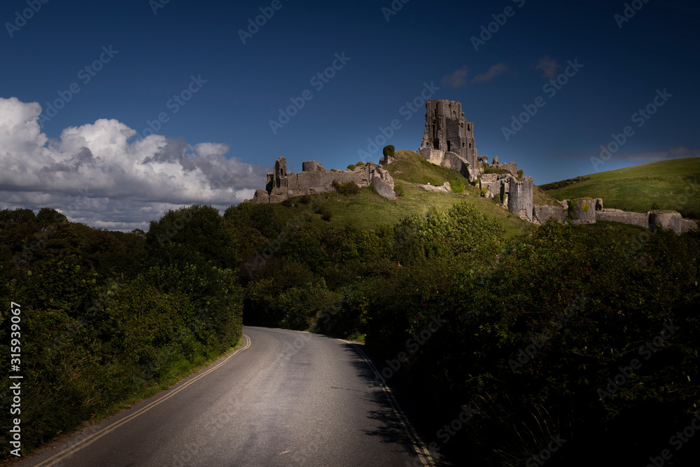 Corfe Castle sitting atop a hill