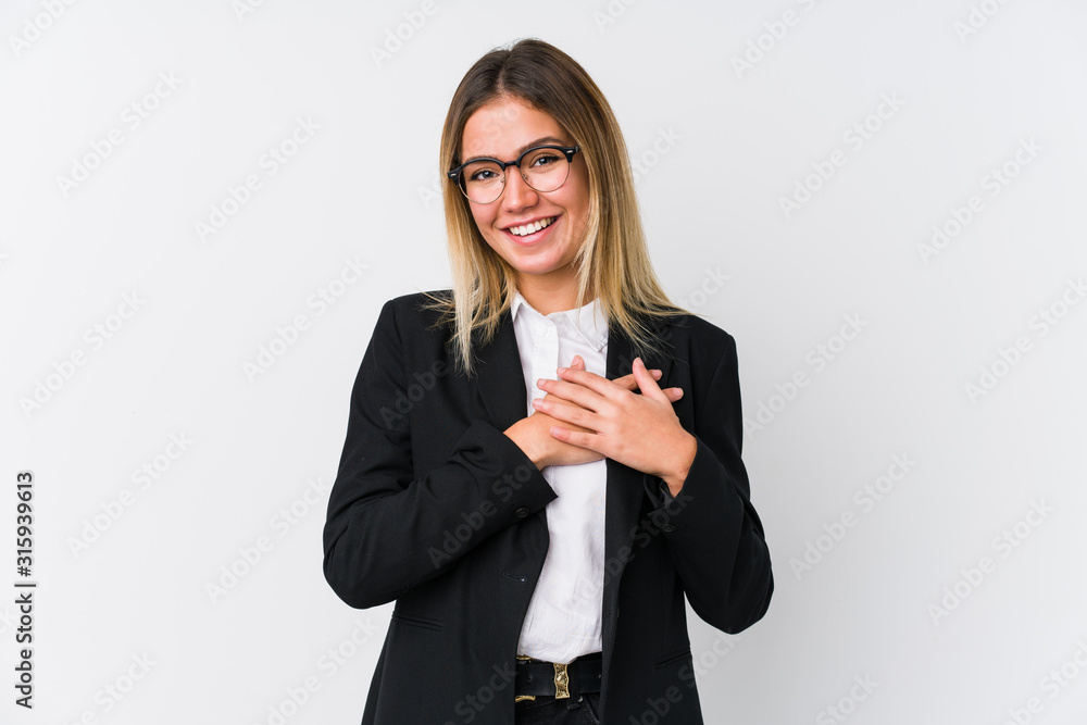 Young business caucasian woman has friendly expression, pressing palm to chest. Love concept. Young business caucasian woman has friendly expression, pressing palm to chest. Love concept.