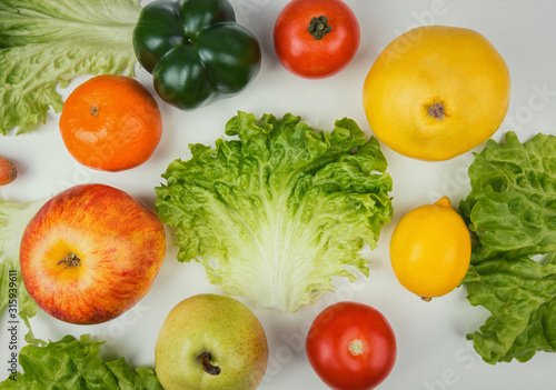 Healthy bio food on the table with space for text in the middle. Organic fruits and vegetables from farm garden. Fresh crop, no genetically modified products. Vegan and vegetarian nutrition.