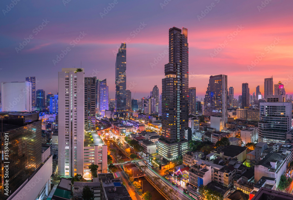 Night rooftop view skyline bangkok twilight, office buildings, living, condominium in bangkok city  skyline top view Downtown and business office bank financial in capital city of thailand asian 