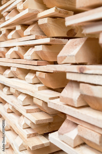 Stock piles of wooden pallets ready for breaking up and recycling into firewood or kindling