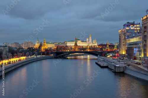 Moscow, Russia - January 10, 2020: Evening view of the Moscow Kremlin, the Big Stone bridge, Prechistenskaya and Bersenevskaya embankments