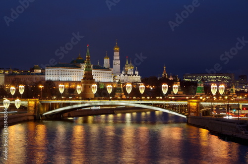 Night view of the Moscow Kremlin and the Big Stone bridge with festive new year illumination. Moscow  Russia