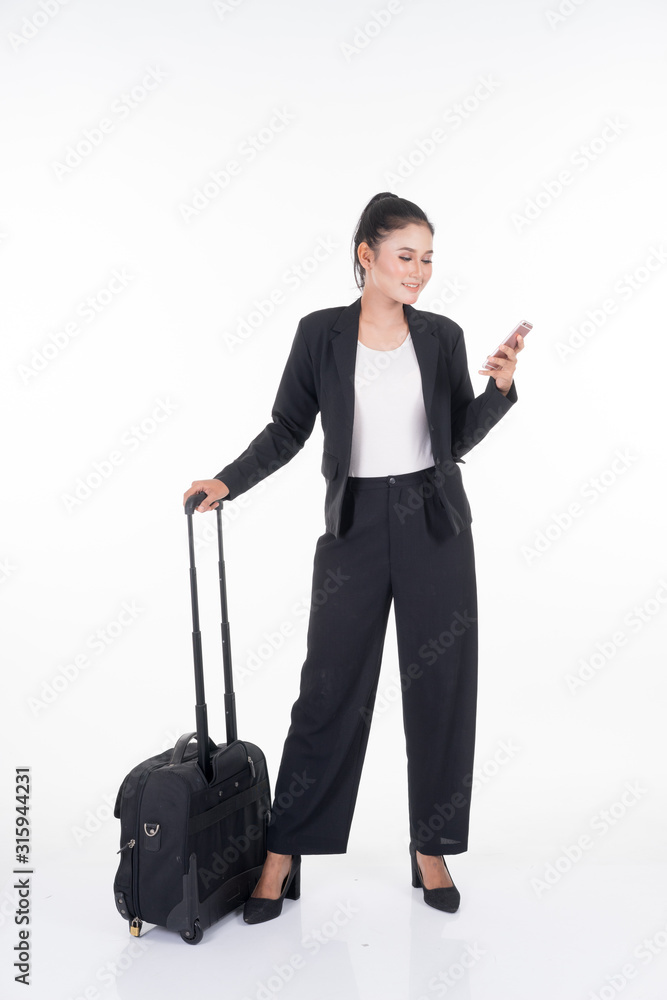 Businesswoman on a business trip, with luggage isolated on white background. Suitable for cut out, manipulation or composite works for travel or business concept.